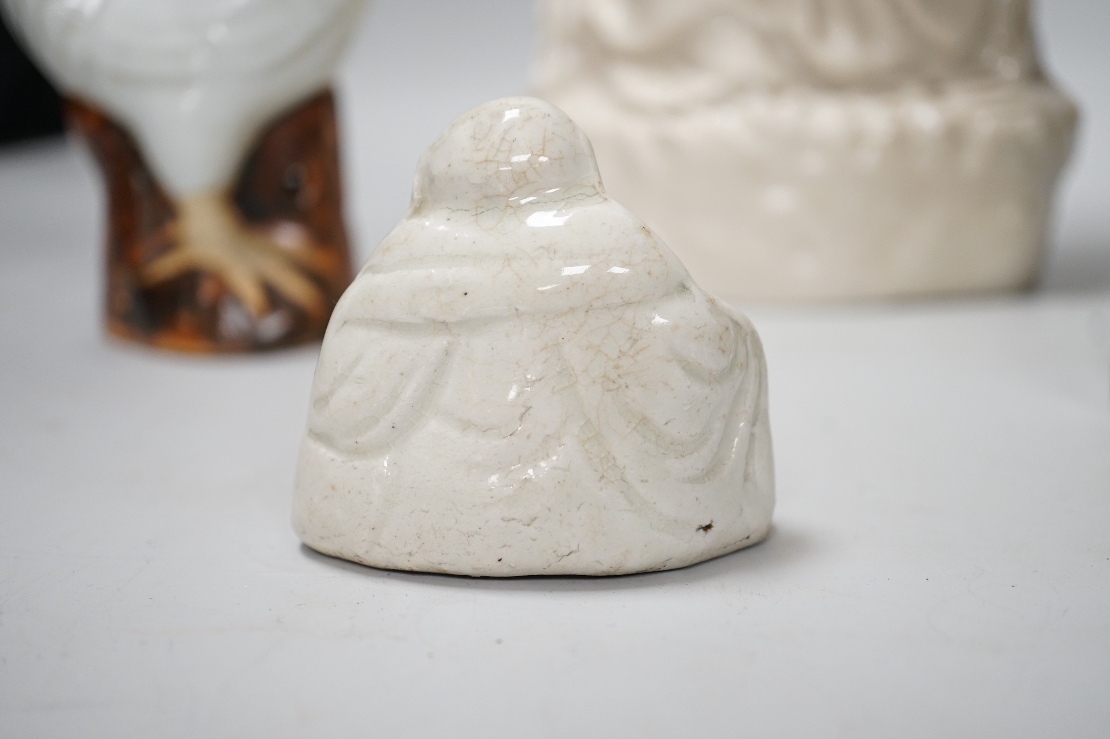 A Chinese enamelled blanc de chine figure of Guanyin, together with three other figures. 28cm tall